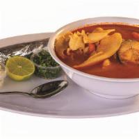  Caldo De Pescado / Fish Broth · Caldo de filete tilapia y bagre complementado con papas y zanahorias servido con cebolla, ci...