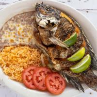 Mojarra Frita · Served with rice, beans, tortillas and salad. Fried perch.
