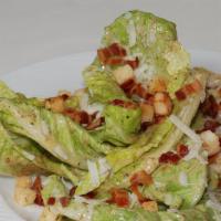 Caesar Salad · Romaine lettuce, croutons, shaved Parmigiano-Reggiano cheese and Caesar dressing.