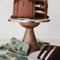 Chocolate Mousse Cake · Chocolate cake layered with whipped cream and chocolate mousse filling with a dark chocolate...