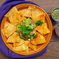 Guacamole · Avocadoes smashed, topped with pico de gallo and served with homemade tortilla chips. (Glute...