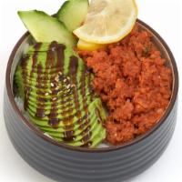 Spicy Tuna Bowl · Spicy tuna and avocado, garnished with cucumber & lemon over. rice.