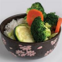 Veggie Bowl · A medley of steamed veggies (cabbage, zucchini, broccoli, &. carrots) served on a bed of rice.