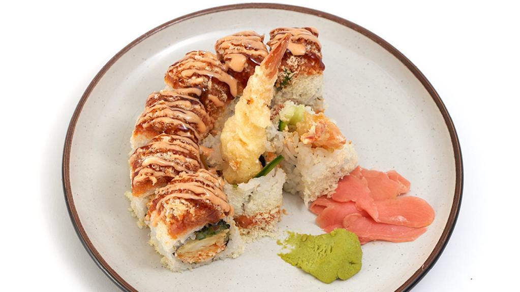 Yogis Roll · Spicy crabmeat, cucumber, & shrimp tempura inside with. spicy tuna & crunch on top.