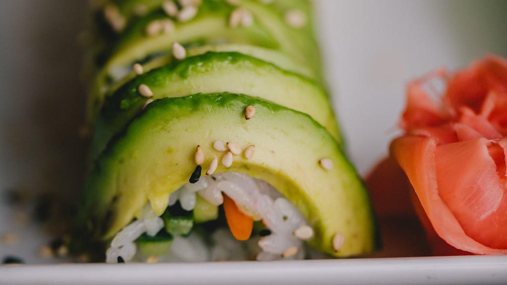Veggie Roll · Cucumber, avocado, & gobo inside with avocado on top.
