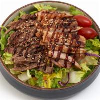 Chicken & Beef Teriyaki Salad · Large garden salad topped with our famous teriyaki. chicken & beef.