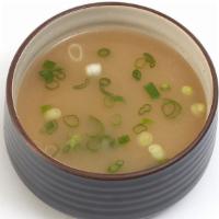 Miso Soup · Traditional Japanese broth with seaweed and green onions.