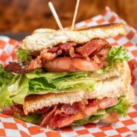 Blt · Bread choice:  white, sourdough or rye served with mayo, lettuce & tomato.