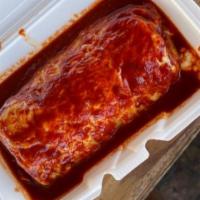Wet Burrito · Smothered with red chili and sauce and melted cheese. Served with meat, rice, beans, cilantr...