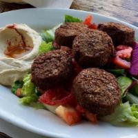 Falafel Flame Plate · 5 crisp fried falafel served with sesame sauce, hummus, pita bread and your choice of salad ...