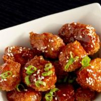 Cauliflower Poppers · Homemade Breaded Cauliflower pieces in a sweet and spicy sauce.