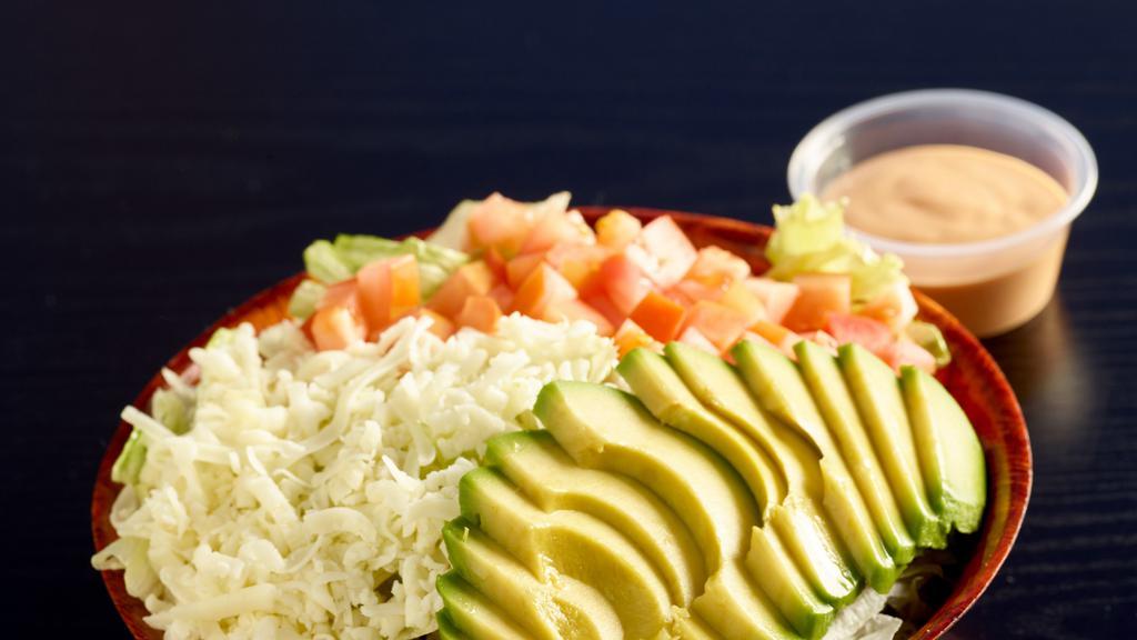 Avocado Salad Gf · Our house salad topped with avocado. Available in gluten free.