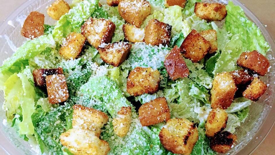 Caesar Salad · Romaine lettuce, croutons, Parmesan cheese tossed with our house made Caesar dressing. Available in gluten free.