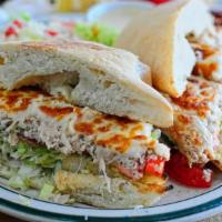 Tuna Melt Sandwich · Served with salad or fries.  Tuna with melted cheese, lettuce and tomato in between our home...