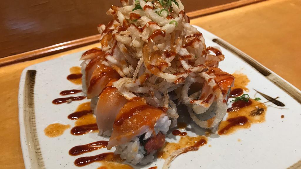 #24. Lady In Red Roll · Spicy tuna and cucumbers. Topped with spicy albacore, crunchy onions, spicy garlic ponzu and spicy sauce.