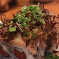 #31. Kenji Roll · Spicy tuna, cucumber, topped with albacore, crispy onion, green onion, eel and ponzu sauce.