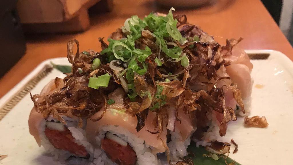 #31. Kenji Roll · Spicy tuna, cucumber, topped with albacore, crispy onion, green onion, eel and ponzu sauce.