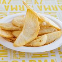 French Fries · Hand-cut,  premium potatoes fried to a golden crisp, tossed in sea salt. Vegan
