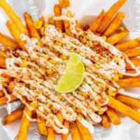 Elote Fries · Seasoned fries topped with grilled corn, cotija cheese, mayo, Mexican crema and chili powder.
