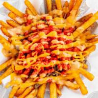 Flamin Fries · Seasoned fries topped with carne asada, nacho cheese, crunchy flamin hot cheetos and house s...