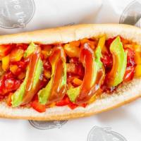 Veggie Dog · Organic VEGGIE SAUSAGE Hot Dog  topped with bell peppers, avocado and ketchup.