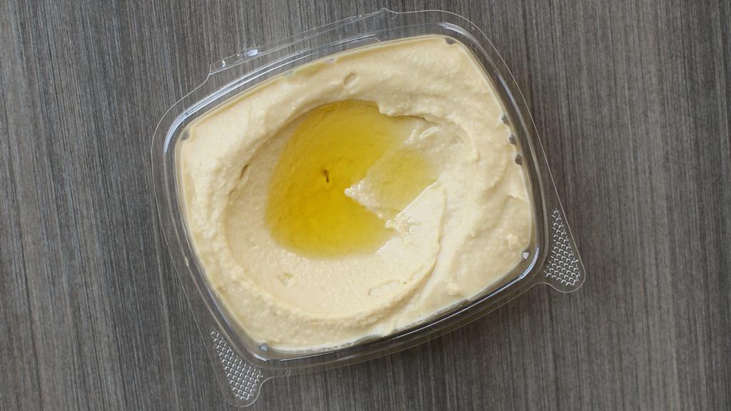 Hummus · Made in House Fresh, Slow Boiled Chickpeas Cooked to perfection And Smashed with Herbs and Spices, Topped with Olive Oil, and Served With 1 Piece of Warm Pita.