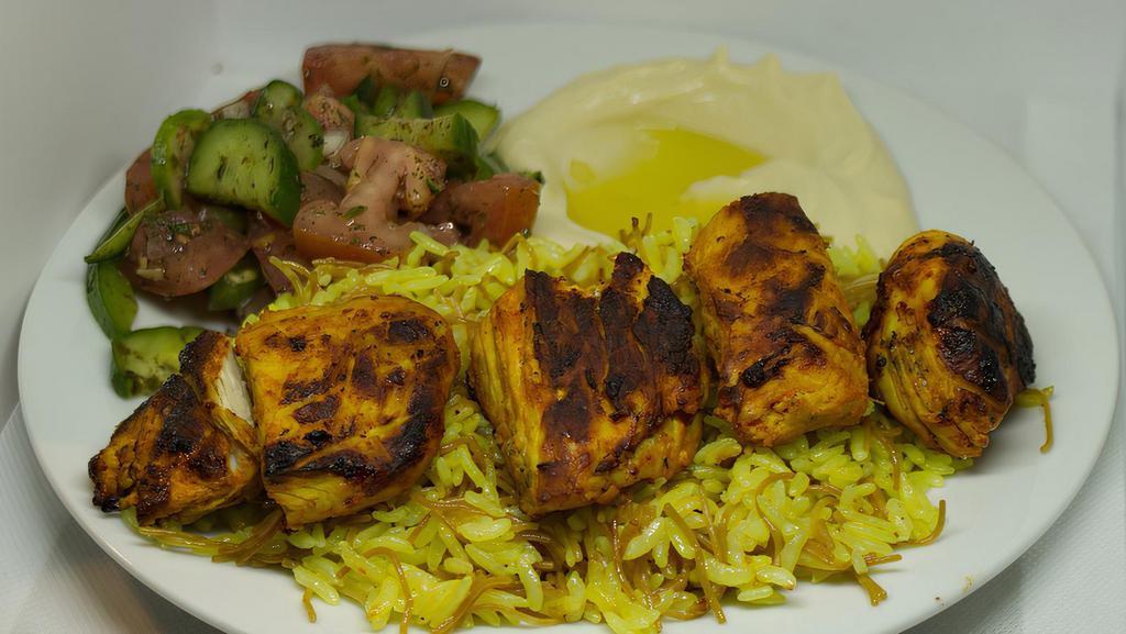 Chicken Kabab · White Meat Chicken on a Skewer, Grilled and Served on a Bed of Rice with your Choice of Sides.