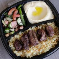 Beef Kabab · Filet Mignon Beef Grilled and Served on a Bed Of Rice, with your Choice of Sides.