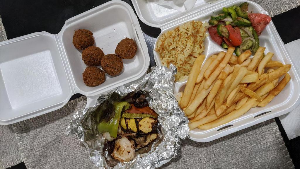 Falafel Plate · Vegetarian (Smashed Chickpeas Mixed with Fresh Garlic, Onions, Parsley and Spices) Deep Fried and Served on a Bed of Rice with your Choice of Sides.