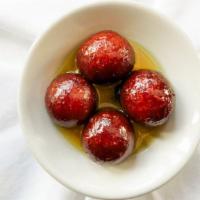 Gulab Jamun (2 Pieces) · Dumplings made of thickened or reduced milk, soaked in a sugar syrup made with rose water.