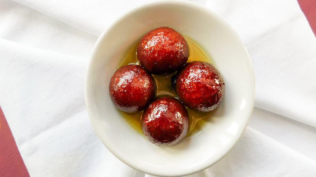 Gulab Jamun (2 Pieces) · Dumplings made of thickened or reduced milk, soaked in a sugar syrup made with rose water.