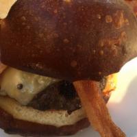 Stuffed - Mac N Cheese · Filled with our house mac n cheese. Pretzel bun, smoked gouda cheese, pickled jalapenos, tom...