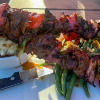 Kobe Style Steak Skewers · Bell peppers, red onions, garlic peppercorn sauce served with garlic mashed potatoes, bacon ...