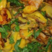 Seafood Nachos · Nacho cheese or shredded cheese, your choice of mahi-mahi or shrimp, beans, grill onion, pic...