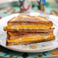 Veggie Three Cheese Grilled Cheese Sandwich · cheddar, swiss, and jack cheeses between two slices of buttery grilled bread