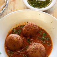 Croquetas · Three rice croquettes, mozzarella, tomato sauce.