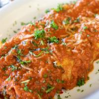 Canelones · Rolled pasta filled with ricotta cheese & spinach in a creamy tomato sauce.