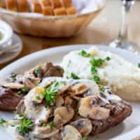 Lomo Lala’S · Grilled choice center cut filet mignon topped with sautéed mushrooms in a light red wine cre...