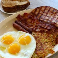 The Slammer · 2 Eggs Hashbrown 
or Grits 2 Bacon 
2 Sausage & Ham 
2 Pancakes or 2 Toast