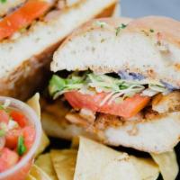 Torta · Mexican sandwich with chicken or steak, onion, lettuce, tomato, and ancho-Chile mayo.