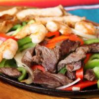 Steak Fajita · Grilled bell peppers tomatoes onion and spices. served with refried beans rice guacamole sou...