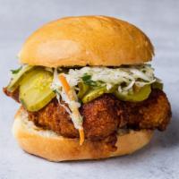 Nashville Style Hot Chicken Sandwich (Medium Hot) · Dipped in chili oil, with spice rub, coleslaw, and cured pickles