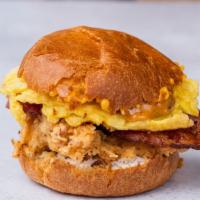 Birdies Breakfast Sandwich With Eggs, Chicken, And Bacon · Over easy or scrambled egg with fried chicken tenders, applewood smoked bacon, caramelized o...