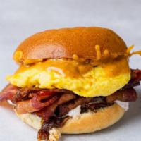 Birdies Breakfast Sandwich With Egg And Bacon Combo · Over easy or scrambled egg with applewood smoked bacon, caramelized onion, and cheddar with ...