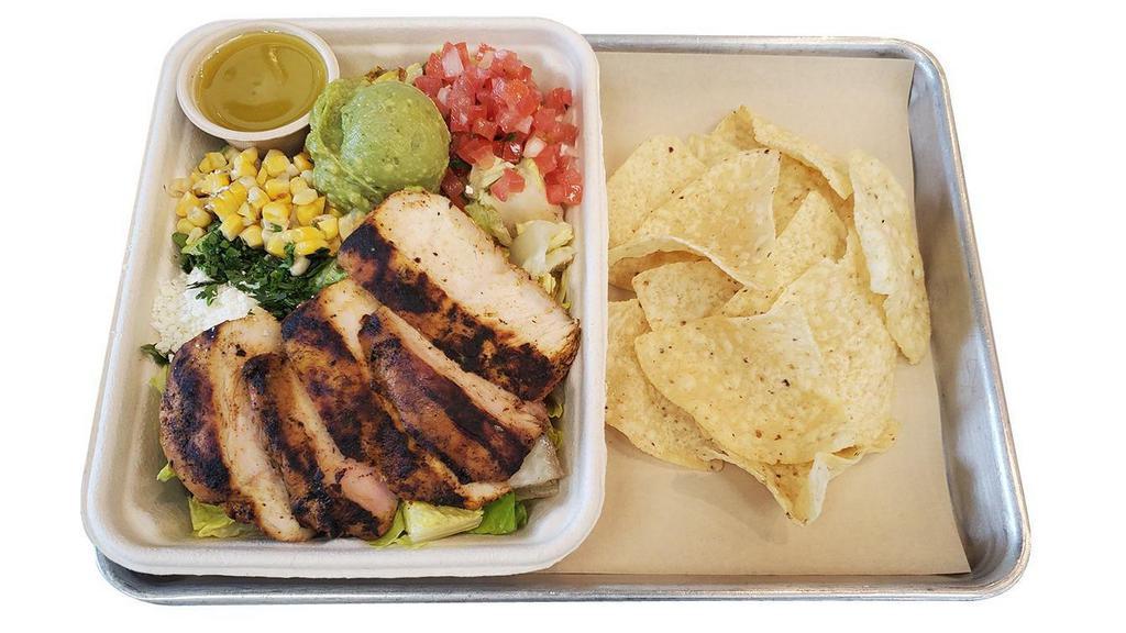 Grilled Chicken Salad · Grilled Romaine lettuce,  grilled chicken, pico de gallo, grilled corn, guacamole, cotija cheese, cilantro-lime vinaigrette, or chipotle ranch dressing, tortilla chips.