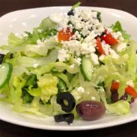 Greek Salad · Romaine hearts, spinach, Persian cucumber, grape tomatoes, kalamata olives, sliced black oli...