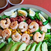 Shrimp Cobb Salad · Crisp Romaine lettuce, delicious grilled shrimp, crispy bacon crumbles, hard boiled egg, avo...