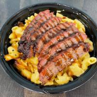 Bbq Tri-Tip Mac · Homemade Mac 'n Cheese topped with Grilled Tri-Tip, and Homemade BBQ Sauce.