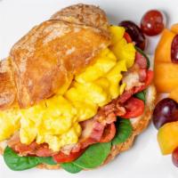 Morning Croissant ** · Scrambled egg, bacon, havarti, spinach and tomato on a croissant. Includes a side of seasona...