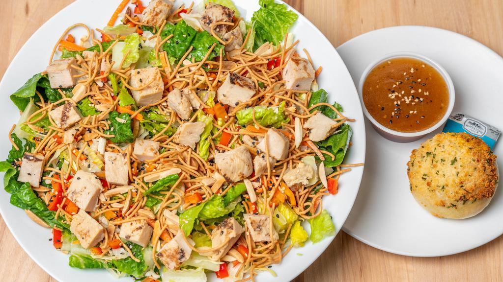 Chinese Chicken Salad · Romaine, grilled chicken breast, cabbage, sweet bell peppers, carrots, green onions, almonds, sesame seeds, rice noodles and Asian Sesame dressing.